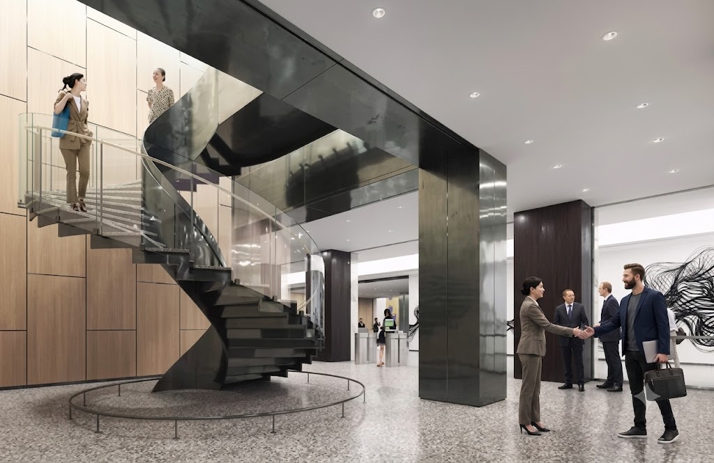 Office lobby with a dark sculptural spiral stair, timber panelling and two people greeting each other